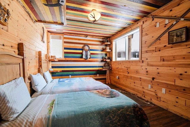 bedroom featuring wood-type flooring, wooden walls, and wooden ceiling