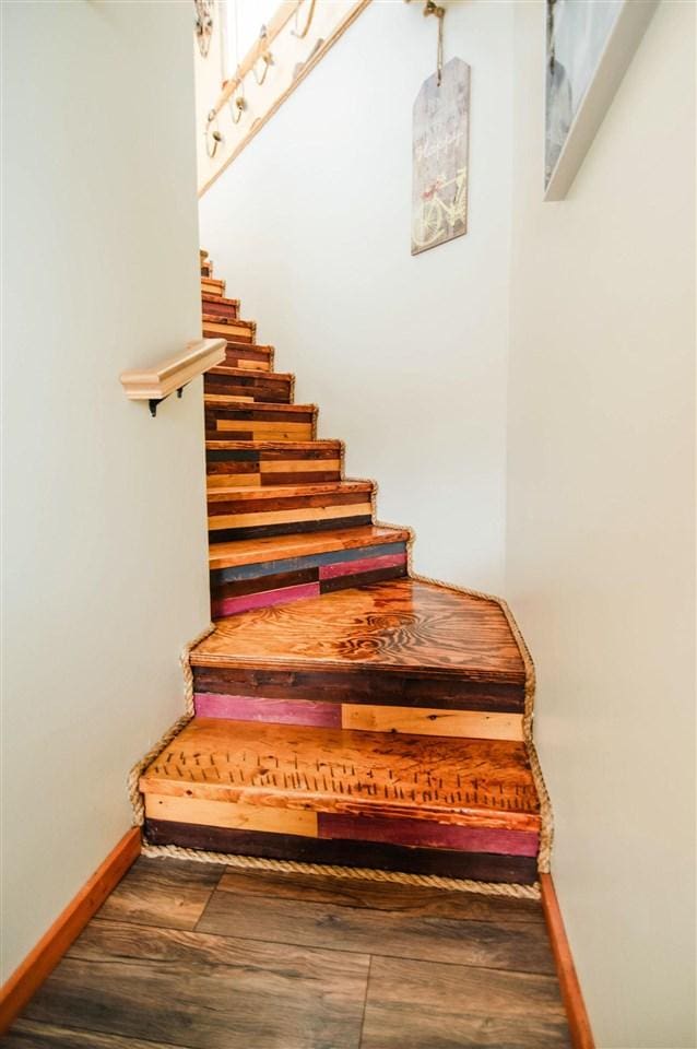 stairway featuring wood-type flooring