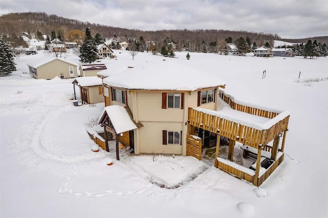 view of snow covered house