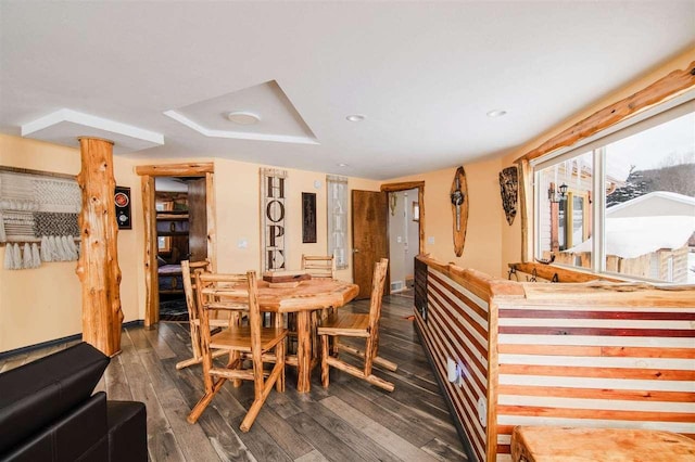 dining space with dark hardwood / wood-style floors