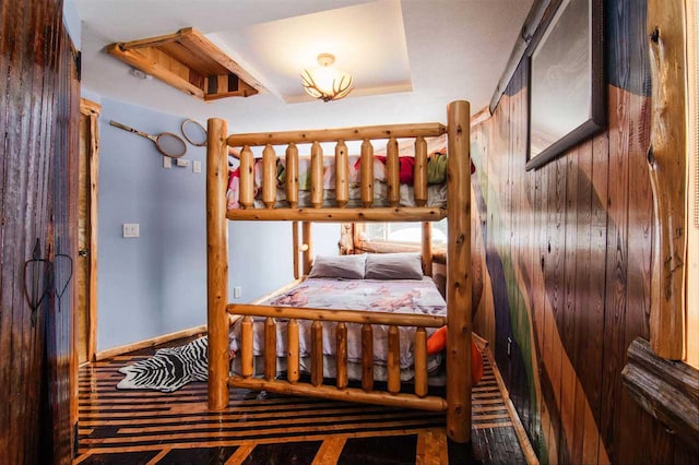 bedroom featuring a raised ceiling