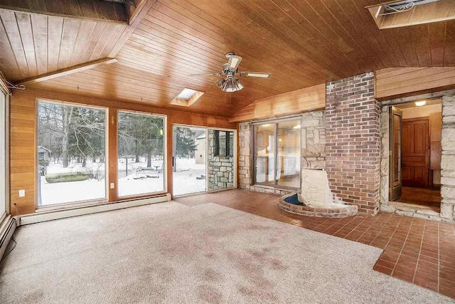 interior space featuring wood ceiling, vaulted ceiling, and plenty of natural light