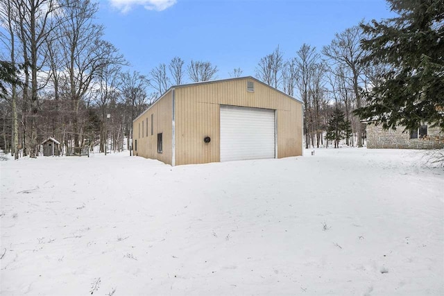 view of snow covered garage