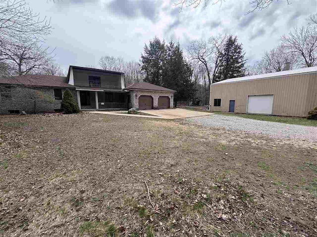 5550 N Lake Shore Dr, Harbor Springs, MI 49740 - view of side of home featuring a detached garage