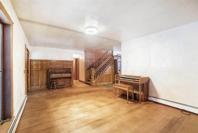 interior space with a baseboard radiator and light wood-type flooring