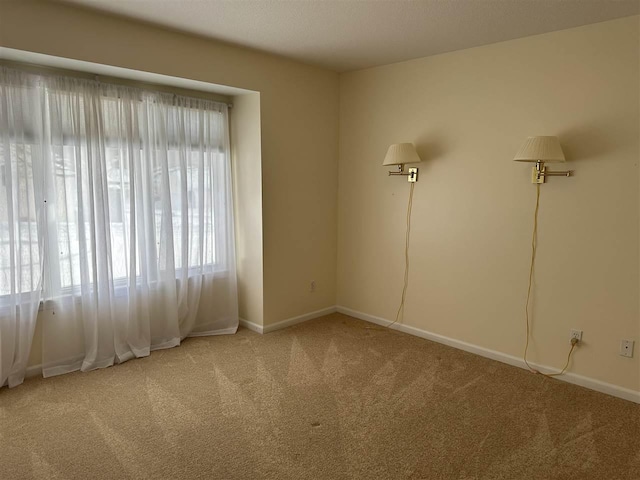 spare room featuring carpet flooring