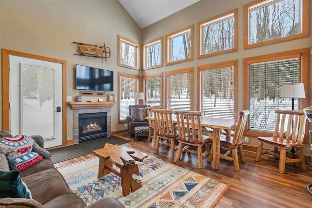 interior space featuring vaulted ceiling and a tile fireplace