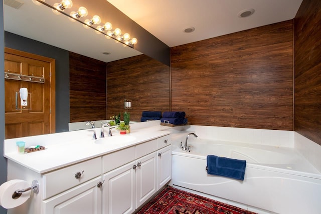 2561 Disciples Ct Unit 6, Boyne Falls, MI 49713 - bathroom with vanity, a garden tub, and wood walls