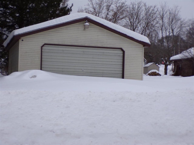 view of snow covered garage