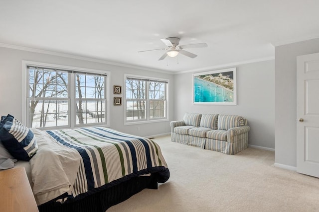 bedroom featuring crown molding, light carpet, and baseboards