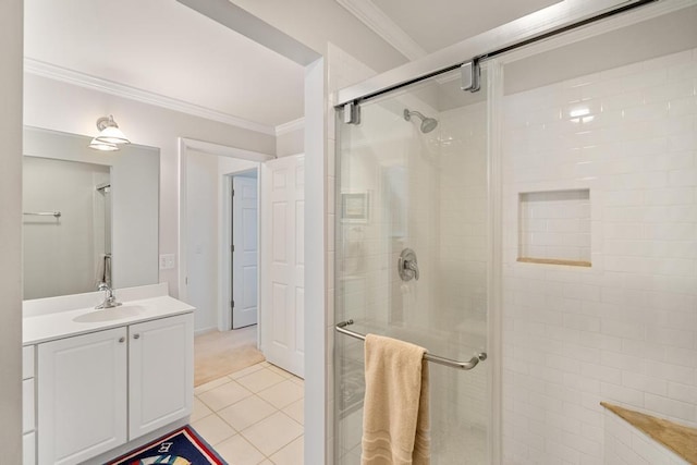 full bathroom with crown molding, tile patterned flooring, vanity, and a shower stall