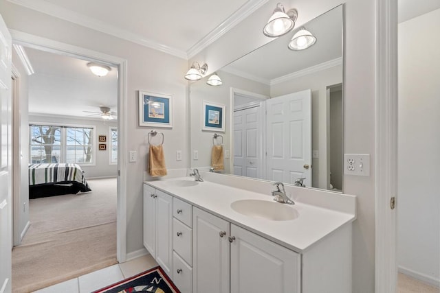 ensuite bathroom featuring double vanity, ensuite bath, crown molding, and a sink