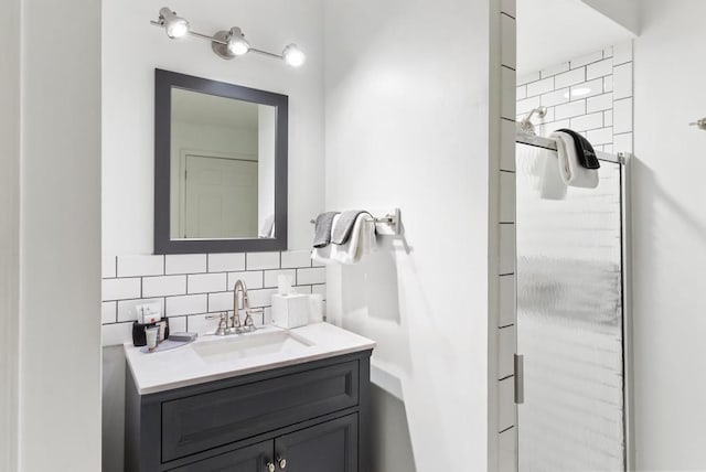 bathroom with tasteful backsplash and vanity