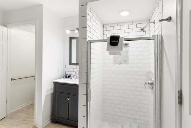 bathroom with tasteful backsplash, vanity, and an enclosed shower