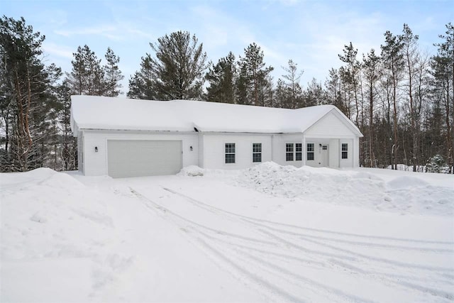 view of snow covered garage