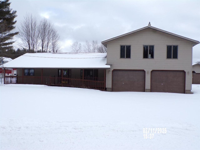 view of front of home with a porch and a garage