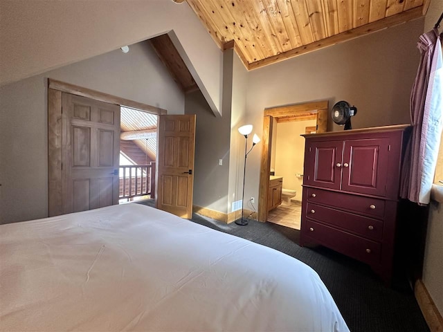 bedroom with lofted ceiling, carpet floors, connected bathroom, and wooden ceiling