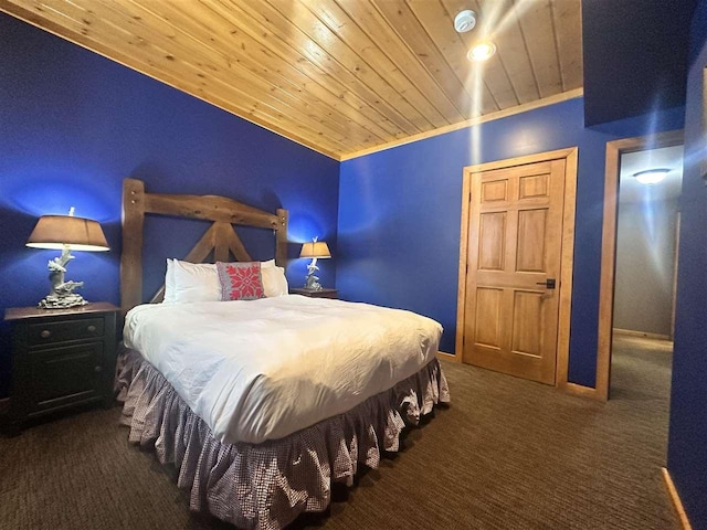 carpeted bedroom with crown molding and wooden ceiling