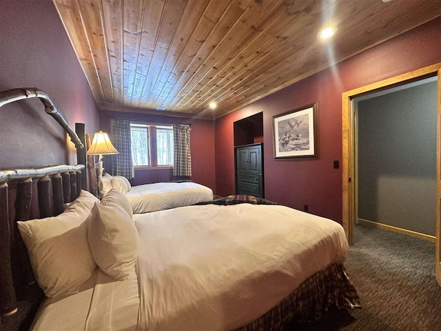 bedroom with wood ceiling and carpet floors