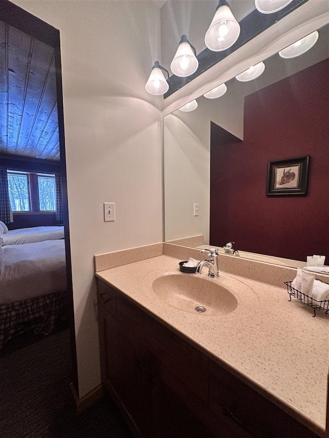 bathroom with vanity and wooden ceiling