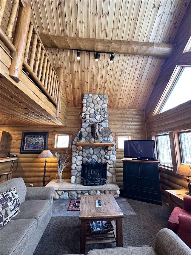 living room with high vaulted ceiling, dark colored carpet, a fireplace, wooden ceiling, and beamed ceiling