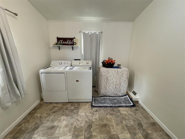 clothes washing area featuring washing machine and dryer