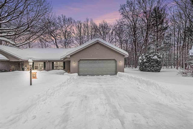 single story home with a garage