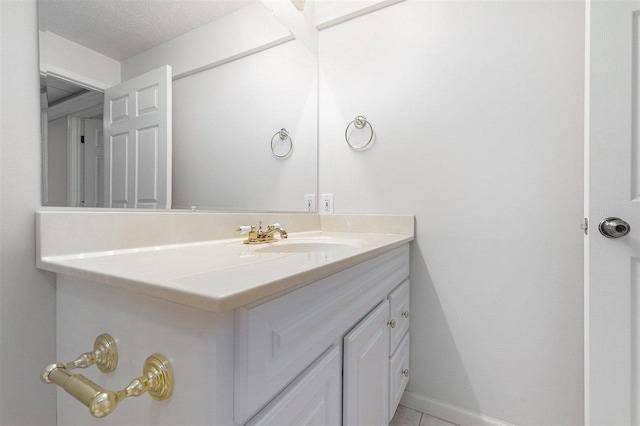 bathroom featuring vanity and a textured ceiling