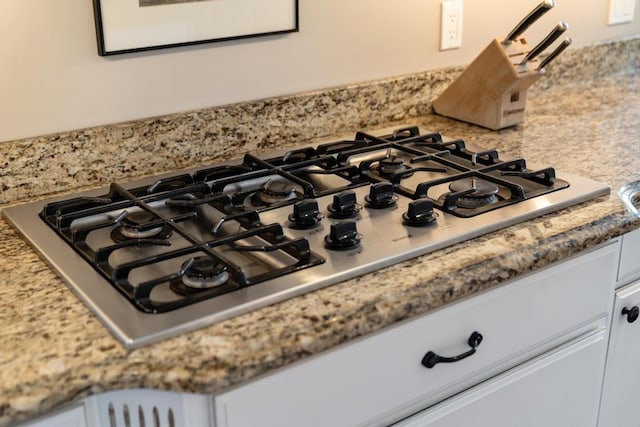 2632 Woodside Dr, Petoskey, MI 49770 - details featuring stainless steel gas cooktop and white cabinetry