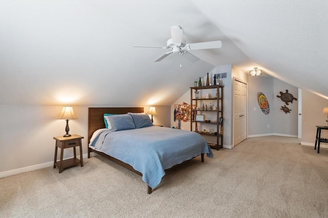 2632 Woodside Dr, Petoskey, MI 49770 - carpeted bedroom featuring visible vents, baseboards, vaulted ceiling, and a ceiling fan