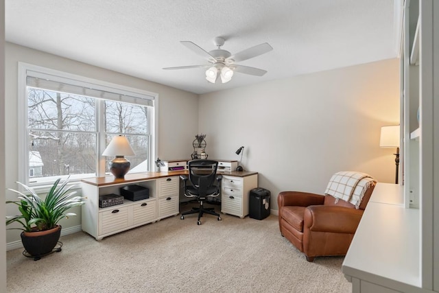 2632 Woodside Dr, Petoskey, MI 49770 - home office featuring light carpet, a ceiling fan, and baseboards