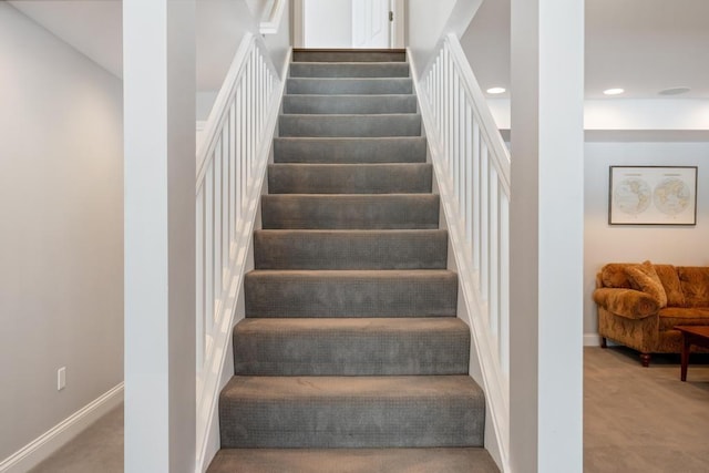2632 Woodside Dr, Petoskey, MI 49770 - stairs featuring baseboards, carpet, and recessed lighting