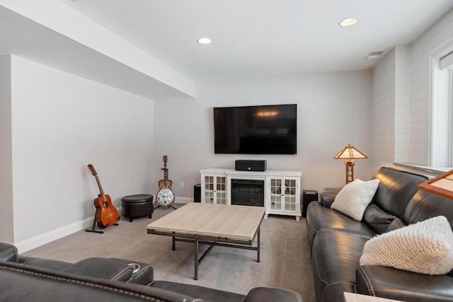 2632 Woodside Dr, Petoskey, MI 49770 - living area with visible vents, baseboards, a glass covered fireplace, carpet floors, and recessed lighting