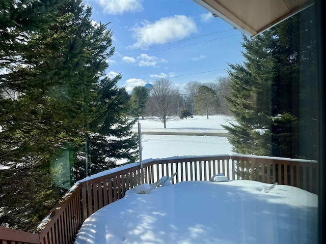 view of snow covered deck