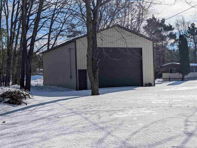 snow covered structure with an outdoor structure