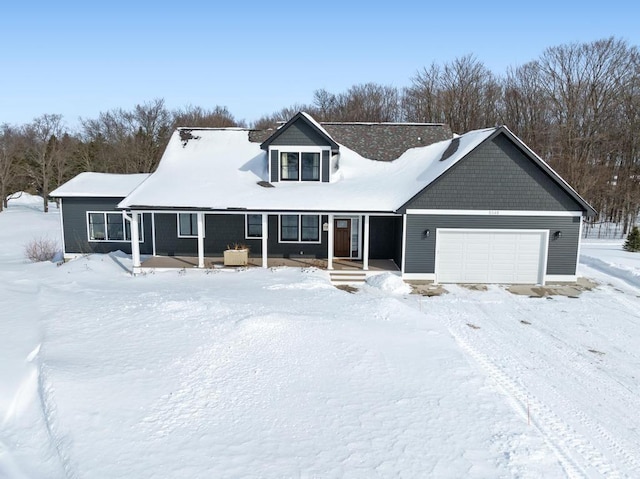 view of front of house with covered porch and a garage