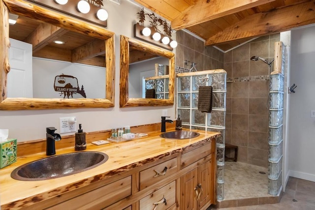 bathroom featuring double vanity, walk in shower, a sink, and wood ceiling