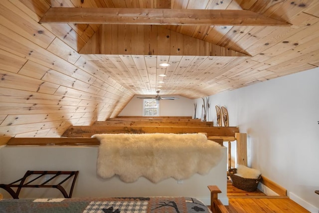 additional living space with wooden ceiling, vaulted ceiling with beams, baseboards, and wood finished floors