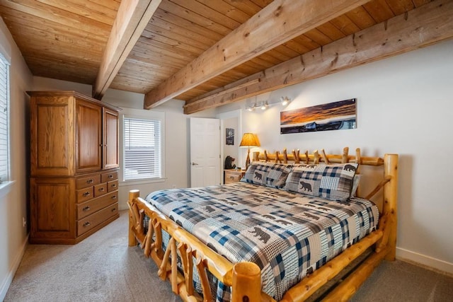 bedroom featuring beam ceiling, light colored carpet, and wooden ceiling