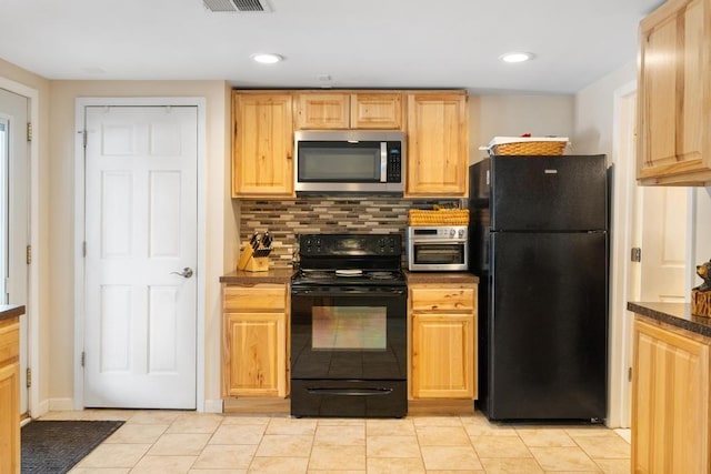 kitchen with tasteful backsplash, dark countertops, visible vents, light brown cabinetry, and black appliances