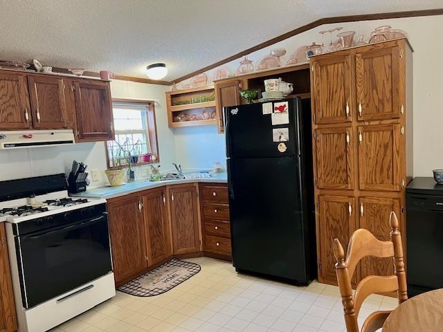 kitchen with open shelves, lofted ceiling, a textured ceiling, black appliances, and extractor fan