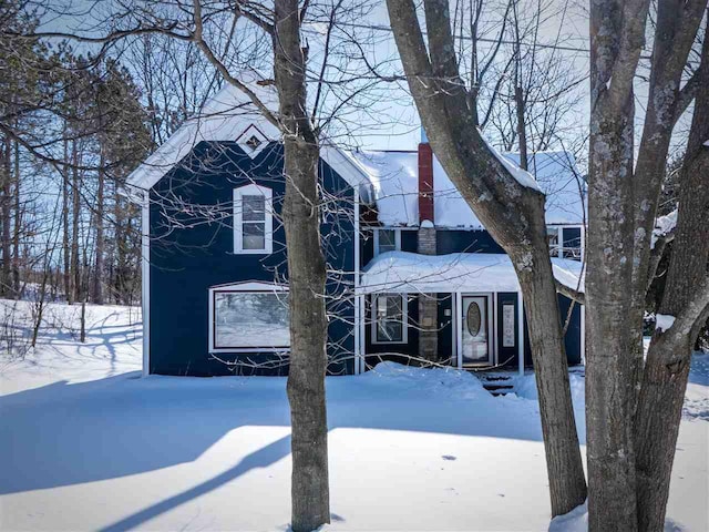 view of front of home featuring a chimney