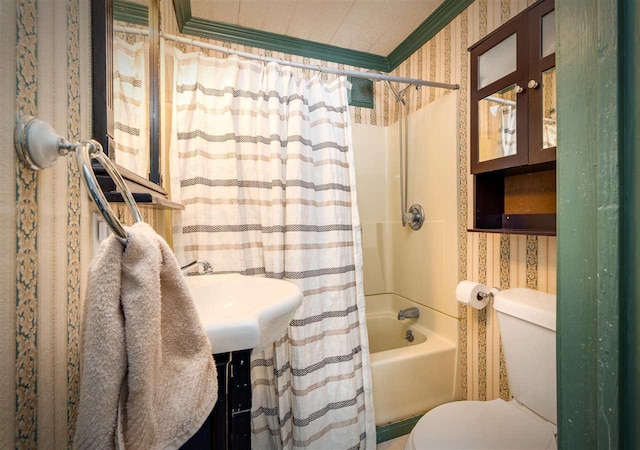 bathroom with ornamental molding, toilet, and wallpapered walls