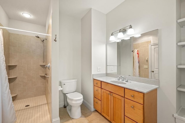 full bathroom with tile patterned flooring, a tile shower, vanity, and toilet