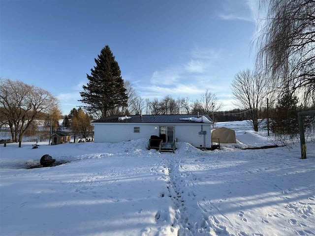 view of snow covered property