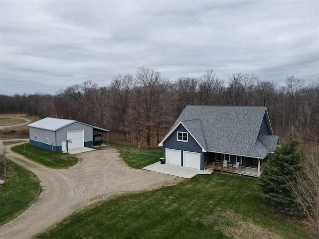 drone / aerial view featuring a view of trees