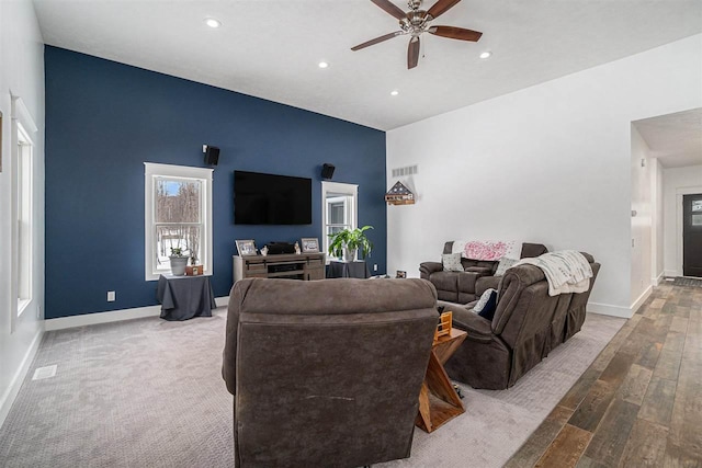 living area featuring recessed lighting, wood finished floors, a ceiling fan, and baseboards