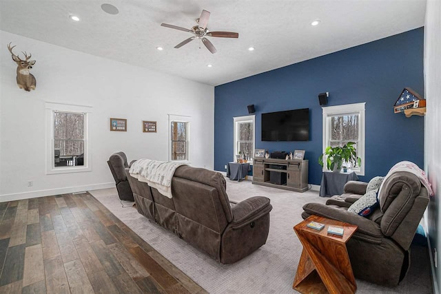 living room with hardwood / wood-style flooring, baseboards, a ceiling fan, and recessed lighting