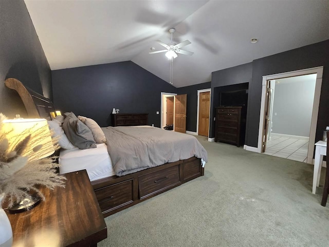 bedroom featuring lofted ceiling, light carpet, a ceiling fan, and baseboards