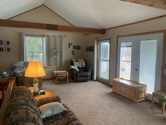 living room featuring lofted ceiling, french doors, and light carpet